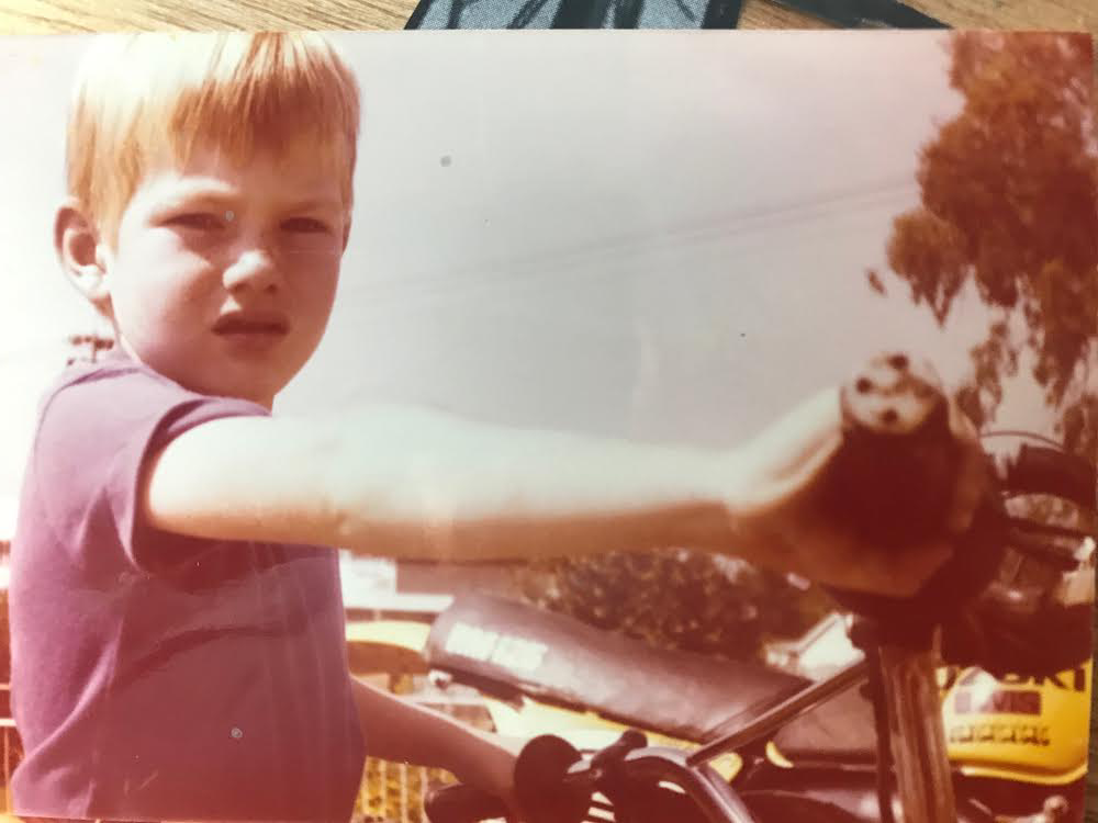 Mark as a boy on his bicycle